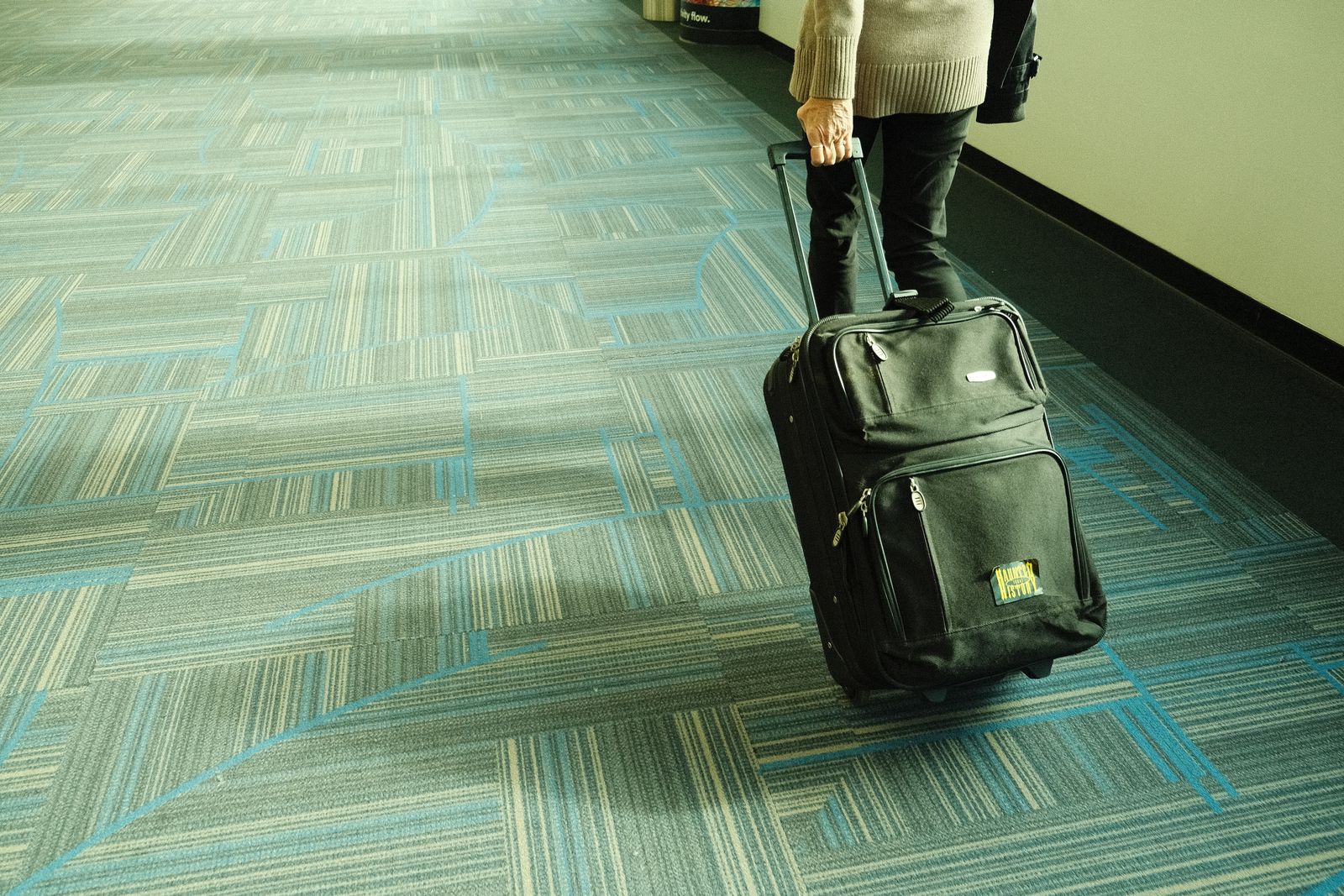 A business traveller walking through an airport